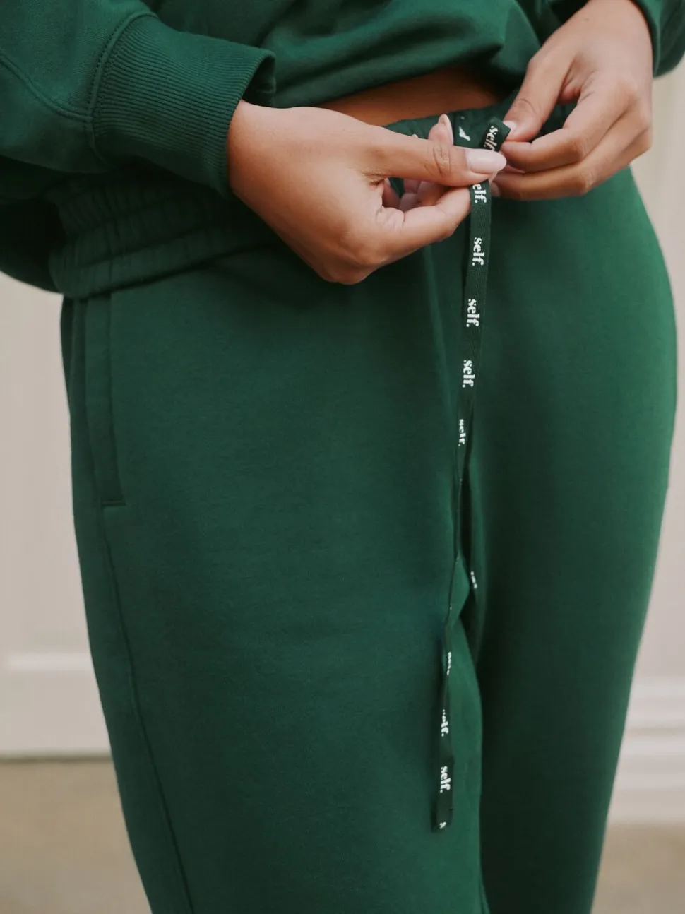 Groen - Self. joggingbroek met boorden