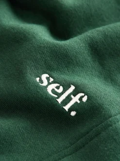 Groen - Self. joggingbroek met boorden