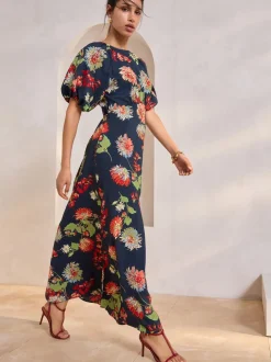 Marineblauw met bloemenprint - Midi-jurk met print en pofmouwen