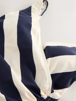 Marineblauw/crèmekleurig - Badpak met vormgevende zijrimpeling en buikcorrectie