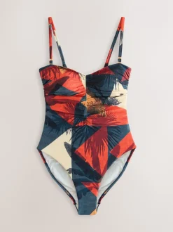 Marineblauw/oranje met palmprint - Vormgevend bandeaubadpak met buikcorrectie