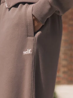 Nertsgrijs/bruin - self. joggingbroek met wijde pijpen