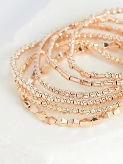 Rozegouden tinten - Set van glinsterende rekbare armbanden