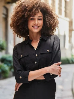 Sosandar jumpsuit met zijStrepen en knoopsluiting aan de voorkant