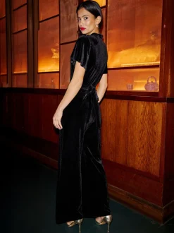 Yumi Velvet Jumpsuit With Twist Neckline And Buckle Belt