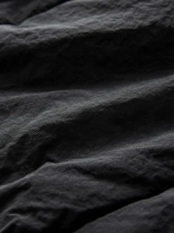 Zwart - Regenbestendige bodywarmer met capuchon en gebreide kraag