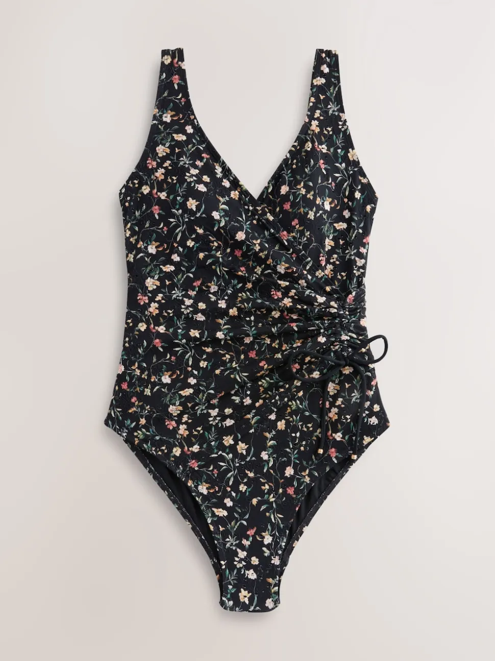 Zwart met broderie en fijne print - Badpak met vormgevende zijrimpeling en buikcorrectie