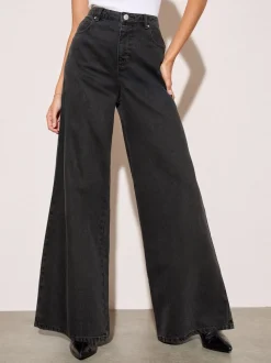 Zwarte wassing - Friends Like These - Relaxte jeans met wijde pijpen