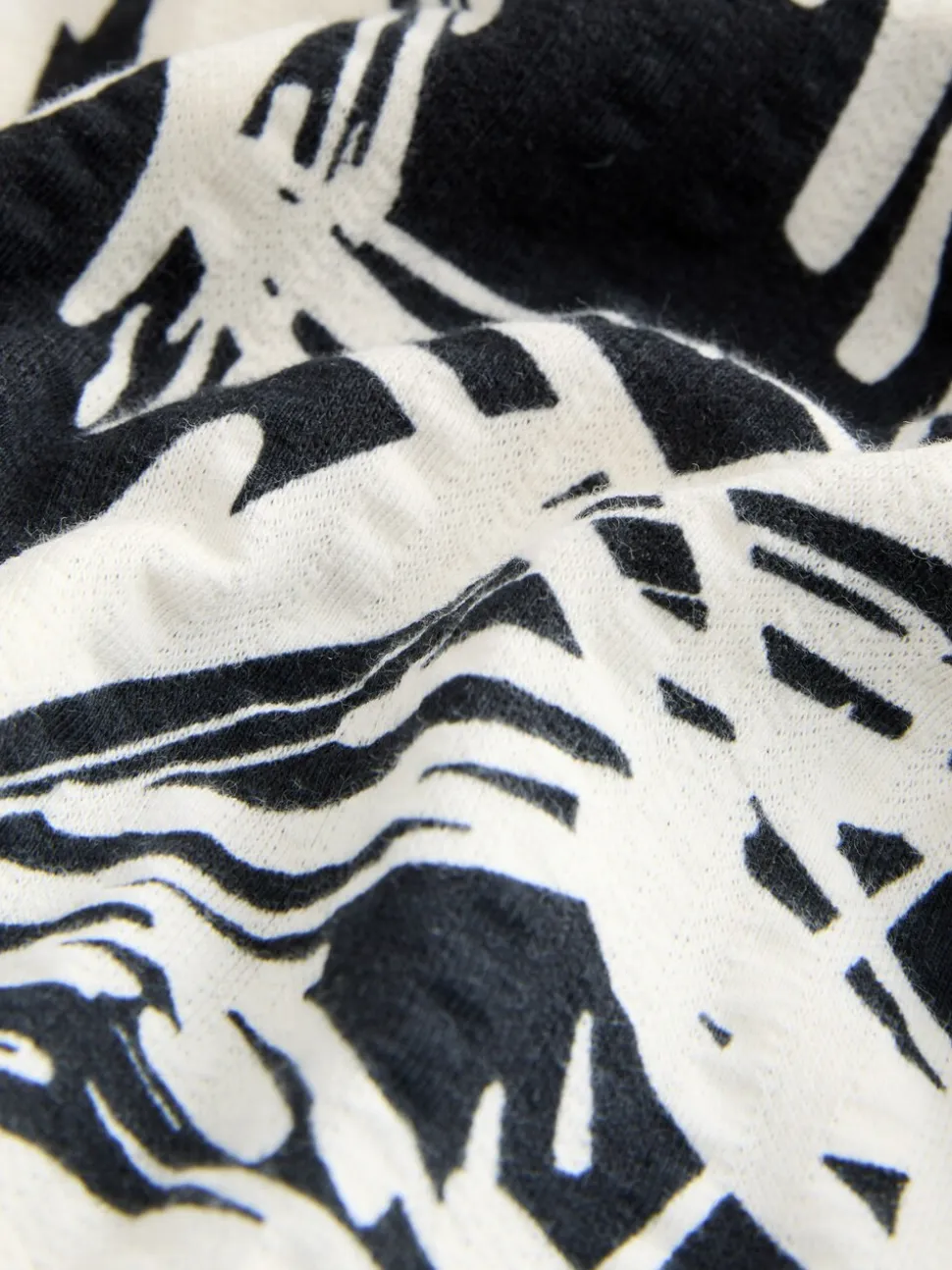 Zwart/wit met palmboomprint - Halflange jersey jurk met knoopsluiting